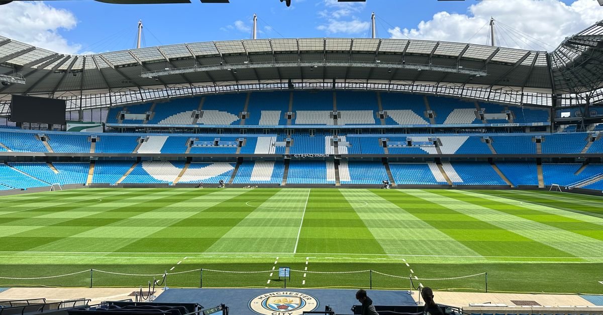 Etihad Stadium in Manchester viewed across the football pitch and stands