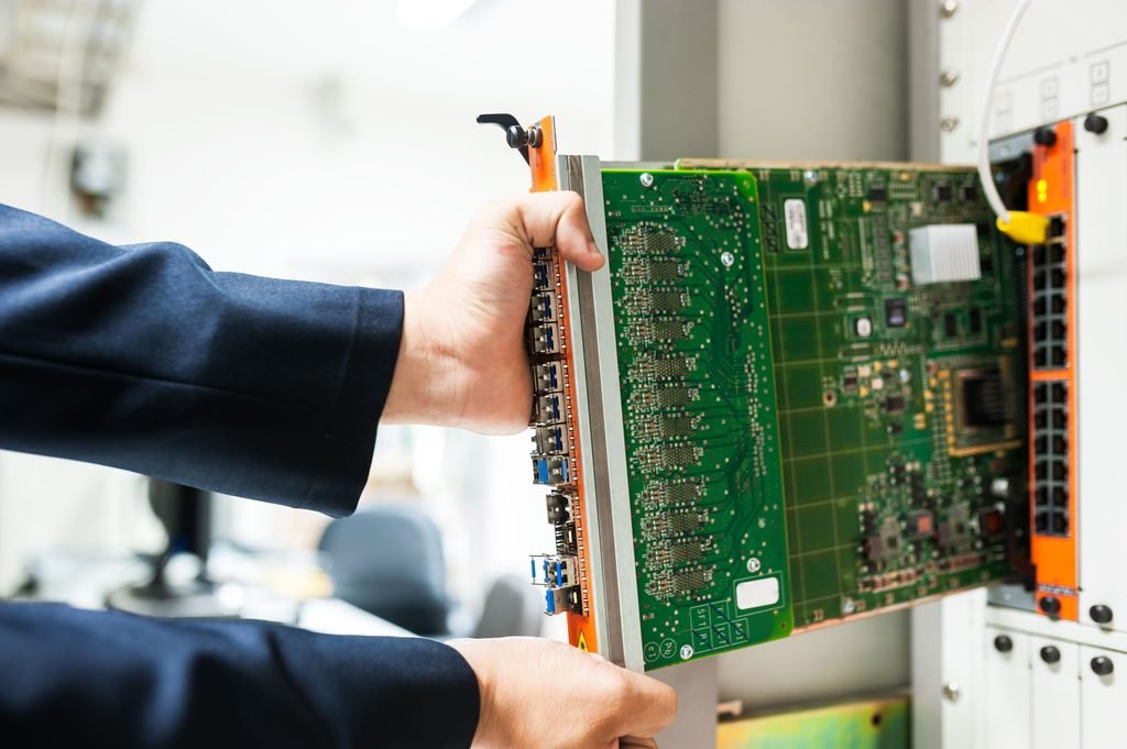 Engineer working on data center infrastructure used for AI security