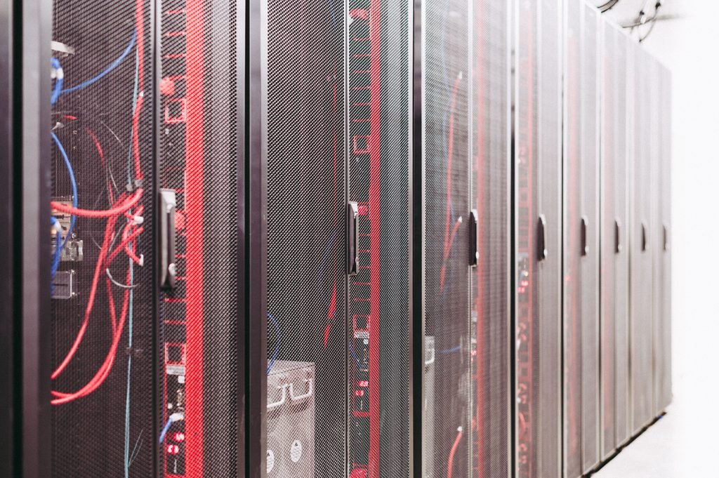 Server racks and network infrastructure supporting autonomous AI agents